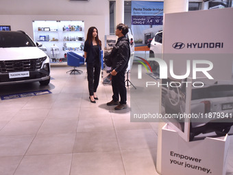 Hyundai cars of various types (hybrid, electric, and gasoline) are displayed at a dealership in Malang, East Java, Indonesia, on December 18...