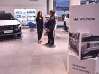 Hyundai cars of various types (hybrid, electric, and gasoline) are displayed at a dealership in Malang, East Java, Indonesia, on December 18...