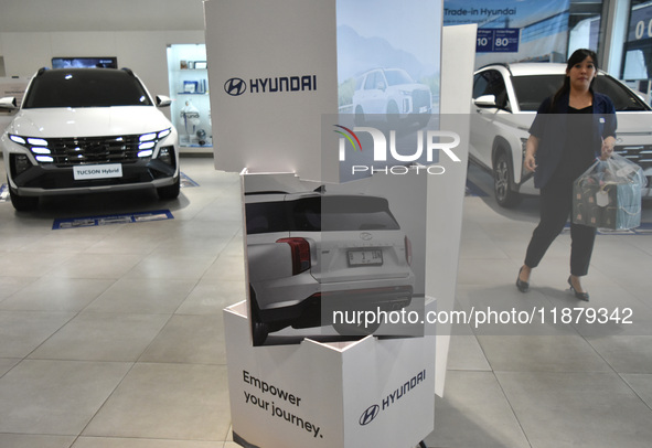 Hyundai cars of various types (hybrid, electric, and gasoline) are displayed at a dealership in Malang, East Java, Indonesia, on December 18...