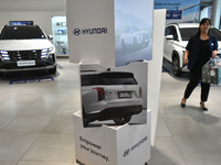 Hyundai cars of various types (hybrid, electric, and gasoline) are displayed at a dealership in Malang, East Java, Indonesia, on December 18...