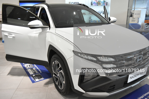 Hyundai cars of various types (hybrid, electric, and gasoline) are displayed at a dealership in Malang, East Java, Indonesia, on December 18...