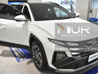 Hyundai cars of various types (hybrid, electric, and gasoline) are displayed at a dealership in Malang, East Java, Indonesia, on December 18...