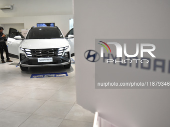 Hyundai cars of various types (hybrid, electric, and gasoline) are displayed at a dealership in Malang, East Java, Indonesia, on December 18...