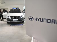 Hyundai cars of various types (hybrid, electric, and gasoline) are displayed at a dealership in Malang, East Java, Indonesia, on December 18...