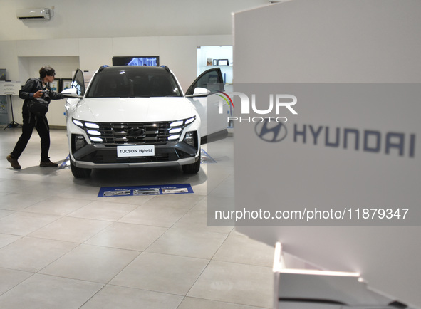 Hyundai cars of various types (hybrid, electric, and gasoline) are displayed at a dealership in Malang, East Java, Indonesia, on December 18...