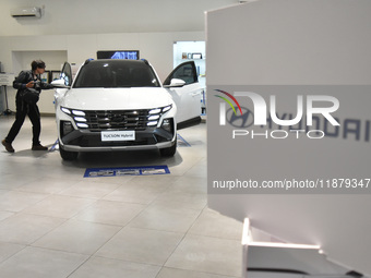 Hyundai cars of various types (hybrid, electric, and gasoline) are displayed at a dealership in Malang, East Java, Indonesia, on December 18...