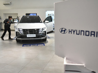 Hyundai cars of various types (hybrid, electric, and gasoline) are displayed at a dealership in Malang, East Java, Indonesia, on December 18...