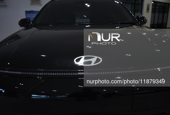 A Hyundai logo on a type of electric vehicle is displayed at a dealership in Malang, East Java, Indonesia, on December 18, 2024. Hyundai sal...