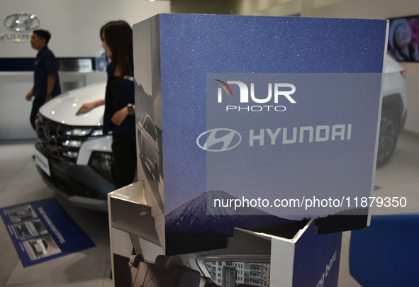 Hyundai cars of various types (hybrid, electric, and gasoline) are displayed at a dealership in Malang, East Java, Indonesia, on December 18...