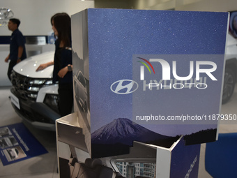 Hyundai cars of various types (hybrid, electric, and gasoline) are displayed at a dealership in Malang, East Java, Indonesia, on December 18...