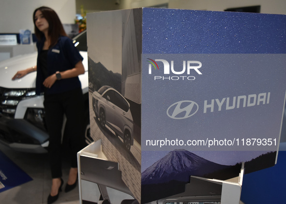 Hyundai cars of various types (hybrid, electric, and gasoline) are displayed at a dealership in Malang, East Java, Indonesia, on December 18...