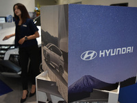 Hyundai cars of various types (hybrid, electric, and gasoline) are displayed at a dealership in Malang, East Java, Indonesia, on December 18...