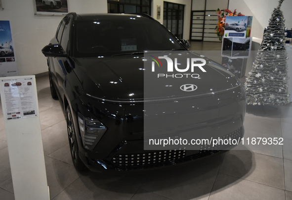 A Hyundai logo on a type of electric vehicle is displayed at a dealership in Malang, East Java, Indonesia, on December 18, 2024. Hyundai sal...