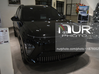 A Hyundai logo on a type of electric vehicle is displayed at a dealership in Malang, East Java, Indonesia, on December 18, 2024. Hyundai sal...