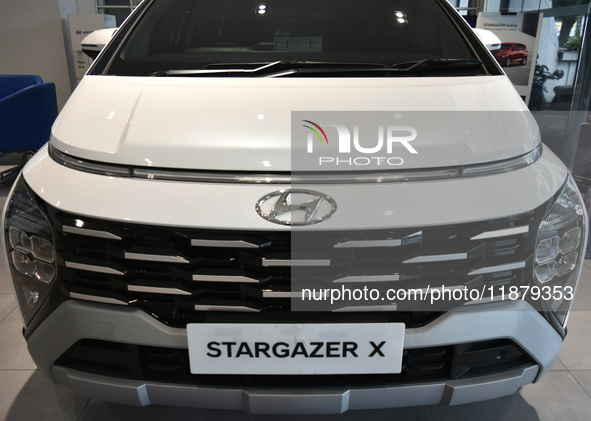 Hyundai cars of various types (hybrid, electric, and gasoline) are displayed at a dealership in Malang, East Java, Indonesia, on December 18...