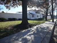 Blood is on the sidewalk and there is damage outside of Johnson Funeral Home on Loch Raven Boulevard following a mass shooting that results...