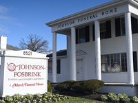 Blood is on the sidewalk and there is damage outside of Johnson Funeral Home on Loch Raven Boulevard following a mass shooting that results...