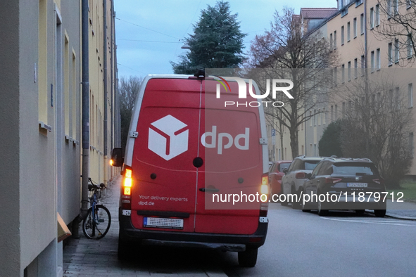 A DPD delivery van parks on a city street in Munich, Bavaria, Germany, in December 2024. The Verdi trade union calls for warning strikes at...