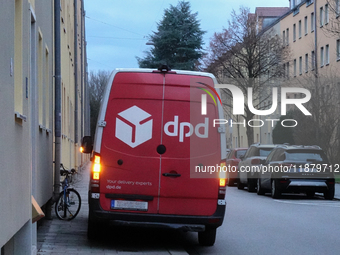 A DPD delivery van parks on a city street in Munich, Bavaria, Germany, in December 2024. The Verdi trade union calls for warning strikes at...