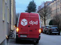 A DPD delivery van parks on a city street in Munich, Bavaria, Germany, in December 2024. The Verdi trade union calls for warning strikes at...