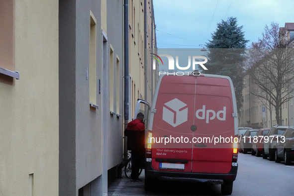 A DPD delivery van parks on a city street in Munich, Bavaria, Germany, in December 2024. The Verdi trade union calls for warning strikes at...