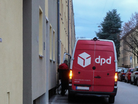 A DPD delivery van parks on a city street in Munich, Bavaria, Germany, in December 2024. The Verdi trade union calls for warning strikes at...