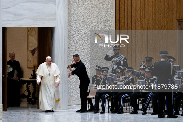 A music band performs as Pope Francis arrives for the weekly general audience in The Vatican, on December 18, 2024, at Paul-VI hall. 