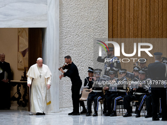 A music band performs as Pope Francis arrives for the weekly general audience in The Vatican, on December 18, 2024, at Paul-VI hall. (