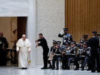 A music band performs as Pope Francis arrives for the weekly general audience in The Vatican, on December 18, 2024, at Paul-VI hall. (