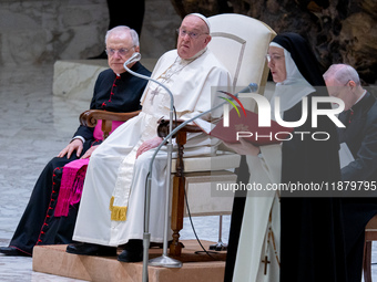 Pope Francis attends his Wednesday General Audience at Paul VI Hall in Vatican City, Vatican, on December 18, 2024. (