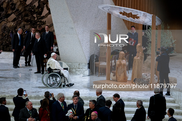 Pope Francis greets the presepe at the end of his Wednesday General Audience at Paul VI Hall in Vatican City, Vatican, on December 18, 2024 