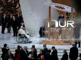 Pope Francis greets the presepe at the end of his Wednesday General Audience at Paul VI Hall in Vatican City, Vatican, on December 18, 2024...