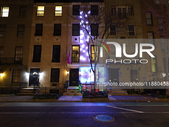 Christmas lights are on display outside a townhouse in the Upper East Side section of New York, N.Y., on December 15, 2024. (