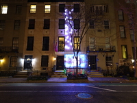 Christmas lights are on display outside a townhouse in the Upper East Side section of New York, N.Y., on December 15, 2024. (