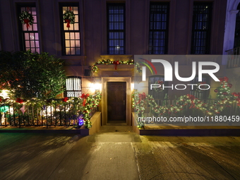 Christmas lights are on display outside a townhouse in the Upper East Side section of New York, N.Y., on December 15, 2024. (