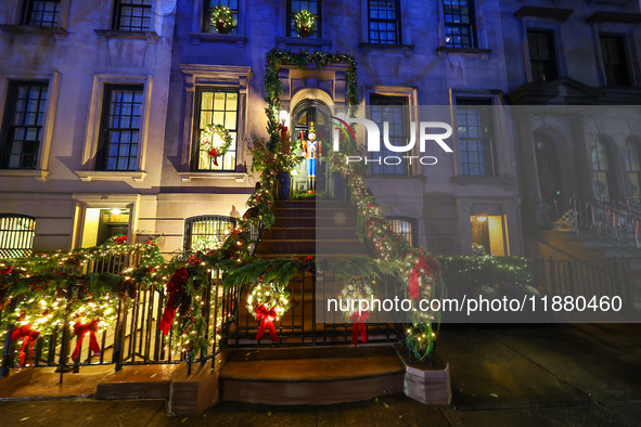 Christmas lights are on display outside a townhouse in the Upper East Side section of New York, N.Y., on December 16, 2024. 