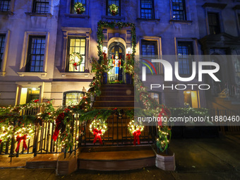 Christmas lights are on display outside a townhouse in the Upper East Side section of New York, N.Y., on December 16, 2024. (