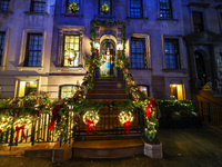 Christmas lights are on display outside a townhouse in the Upper East Side section of New York, N.Y., on December 16, 2024. (