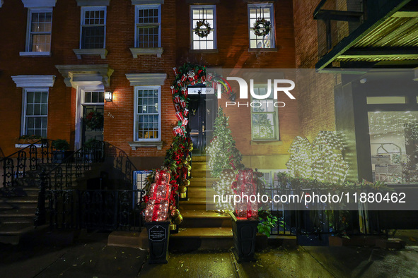 Christmas lights are on display outside a townhouse in the Upper East Side section of New York, N.Y., on December 16, 2024. 