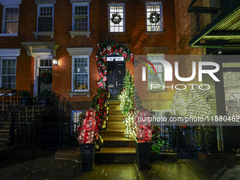 Christmas lights are on display outside a townhouse in the Upper East Side section of New York, N.Y., on December 16, 2024. (