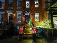 Christmas lights are on display outside a townhouse in the Upper East Side section of New York, N.Y., on December 16, 2024. (