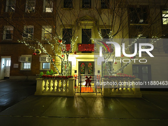 Christmas lights are on display outside a townhouse in the Upper East Side section of New York, N.Y., on December 16, 2024. (