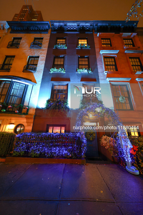 Christmas lights are on display outside a townhouse in the Upper East Side section of New York, N.Y., on December 16, 2024. 