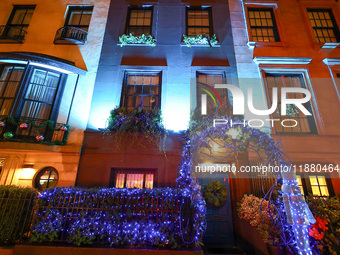 Christmas lights are on display outside a townhouse in the Upper East Side section of New York, N.Y., on December 16, 2024. (