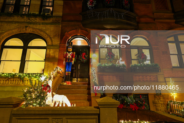 Christmas lights are on display outside a townhouse in the Carnegie Hill section of New York, N.Y., on December 15, 2024. 