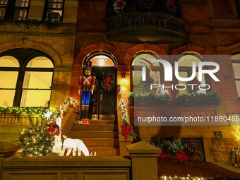 Christmas lights are on display outside a townhouse in the Carnegie Hill section of New York, N.Y., on December 15, 2024. (