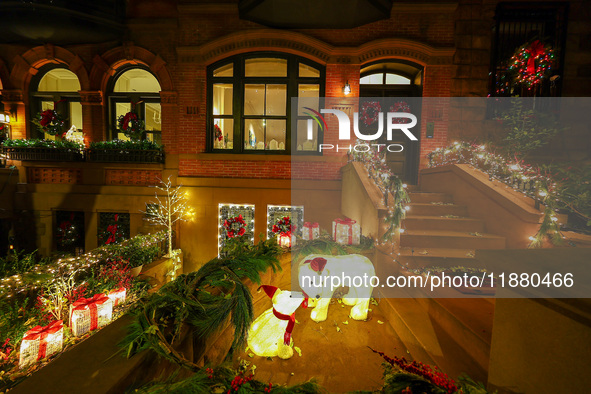 Christmas lights are on display outside a townhouse in the Carnegie Hill section of New York, N.Y., on December 15, 2024. 