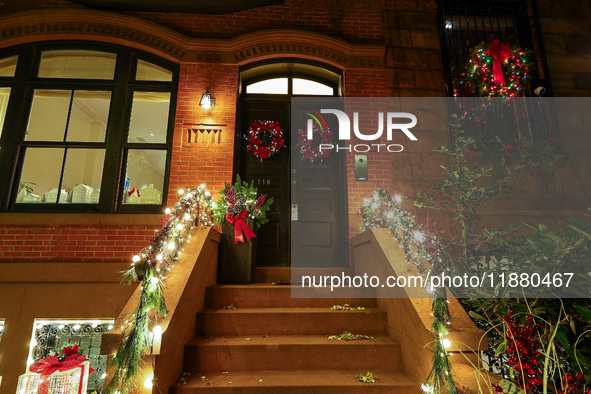 Christmas lights are on display outside a townhouse in the Carnegie Hill section of New York, N.Y., on December 15, 2024. 