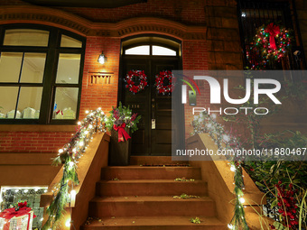 Christmas lights are on display outside a townhouse in the Carnegie Hill section of New York, N.Y., on December 15, 2024. (