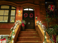 Christmas lights are on display outside a townhouse in the Carnegie Hill section of New York, N.Y., on December 15, 2024. (